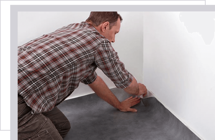 a person inspecting a carpet