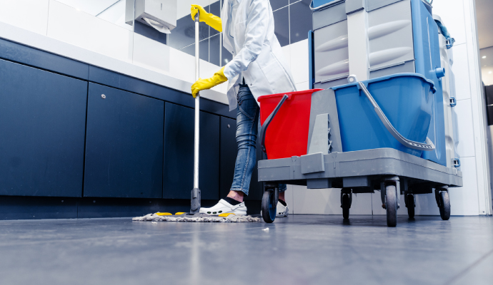 Expert cleaning floor using equipment.