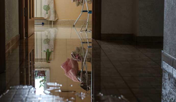 Flooded tiled floor in the room