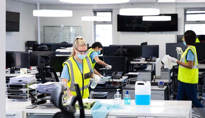 Person cleaning office with equipment