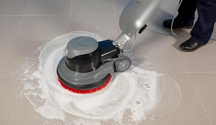 Professional cleaning floor using equipment