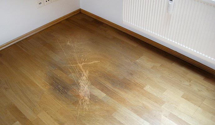 Visible scratches on wooden floor